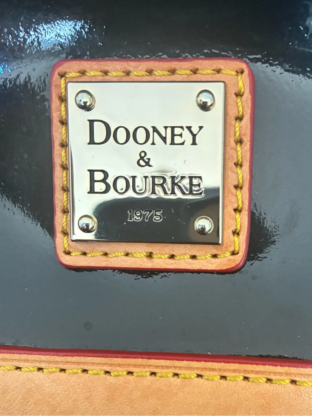 Dooney & Bourke Black Patent Leather Satchel with Tan Trim and Red-Accent Strap